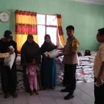Bhabinkamtibmas Desa Jambu Kawal Pembagian Beras Rastra