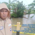 Antisipasi Banjir, Bhabinkamtibmas Pantau Wilayah Binaan Setelah Diguyur Hujan